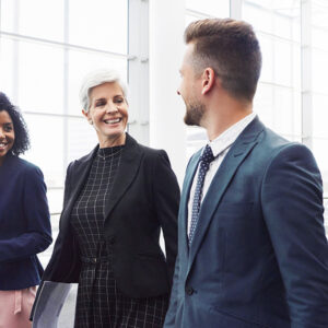 Three colleagues walking and talking