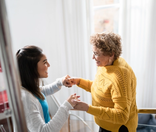 Doctor helping a patient with Parkinson's disease